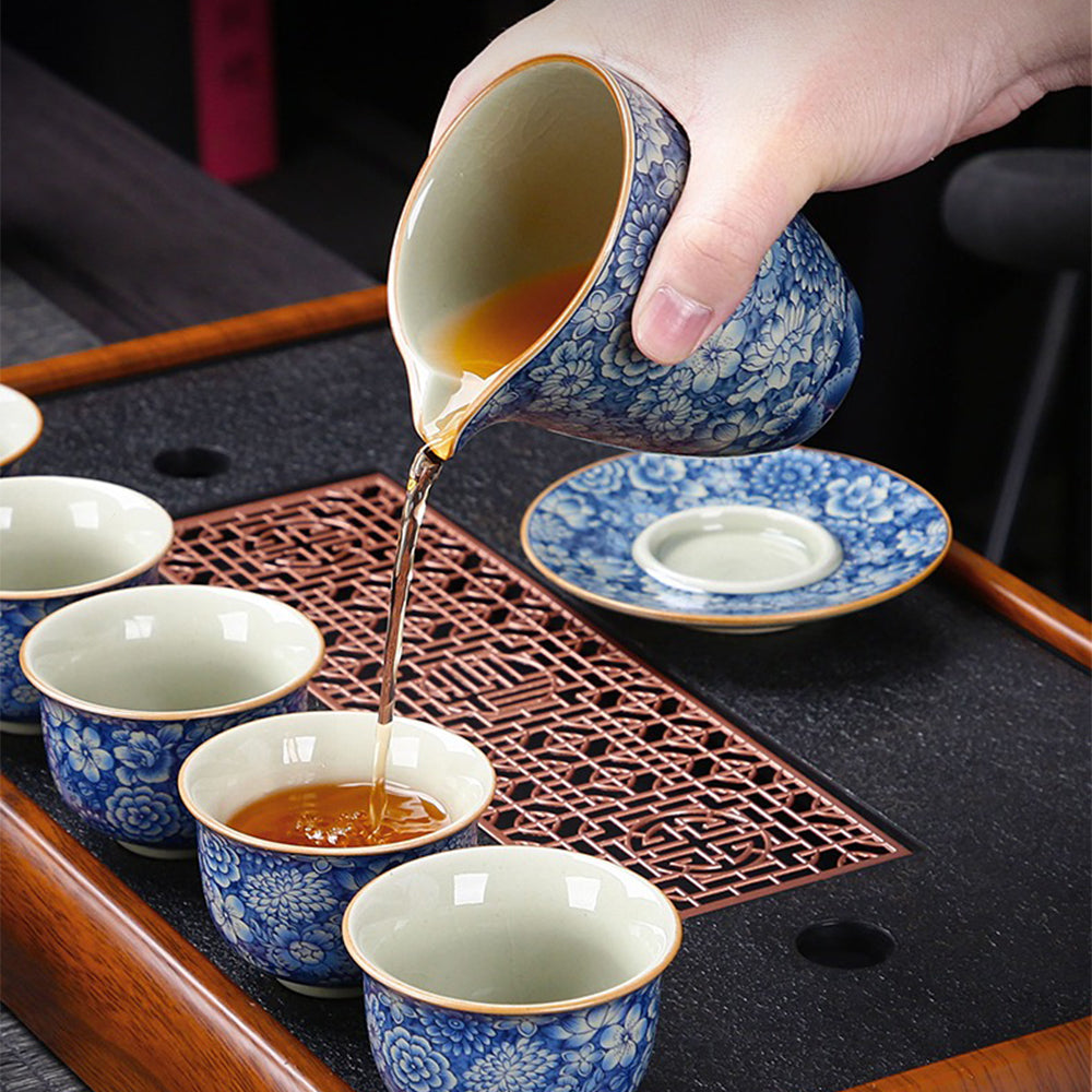 Elegant blue and white porcelain tea set displayed on a wooden table, perfect for home use.