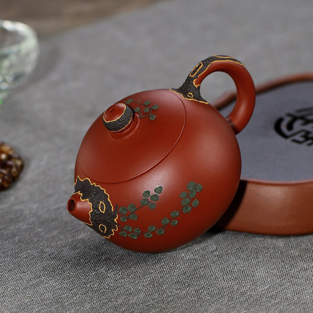 Close-up of the Yixing teapots spout and handle, demonstrating its ergonomic design for easy pouring.