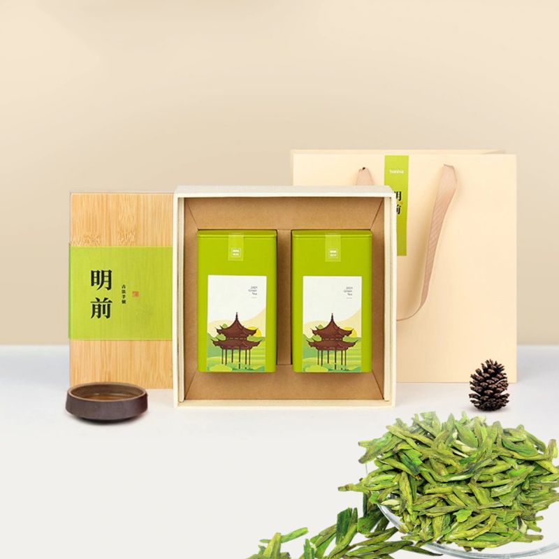 Close-up of fresh Longjing green tea leaves in a Chinese tea gift box