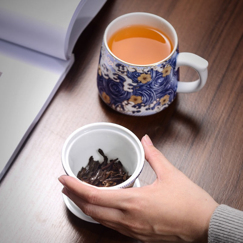 Elegant Chinese Sea Wave Tea Cup with Infuser displayed on a wooden desk, highlighting its artistic value.