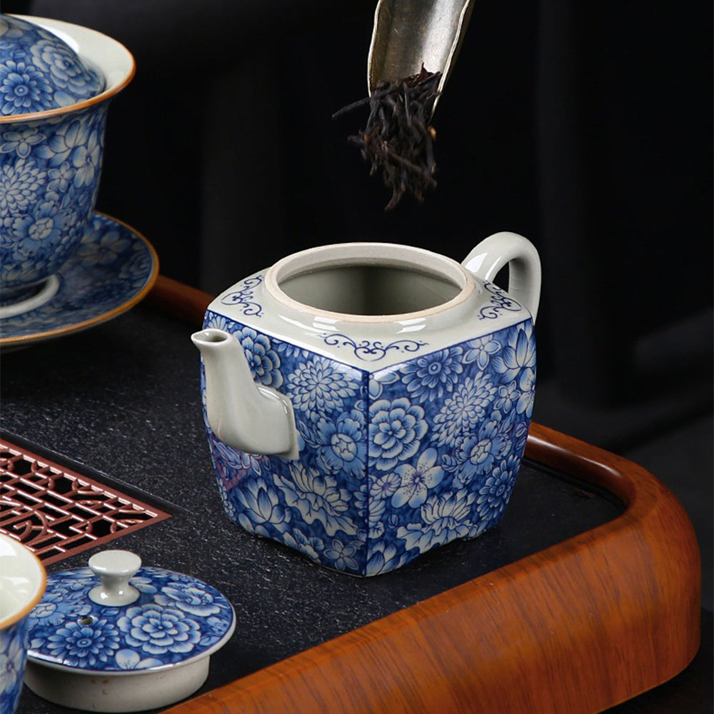 Close-up of the vibrant floral patterns on the luxury blue and white tea set, showcasing intricate craftsmanship.