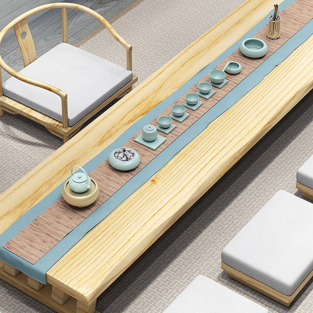 Comfortable seating arrangement featuring the solid wood tea table and plush cushions.