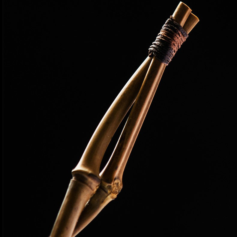 Close-up of the premium bamboo teapot cleaning brush showcasing its bristles and handle.