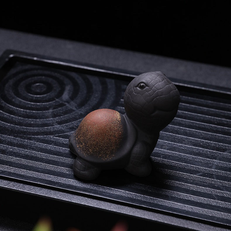 Close-up of the handmade Yixing Clay Tortoise Tea Pet showcasing its intricate details and craftsmanship.