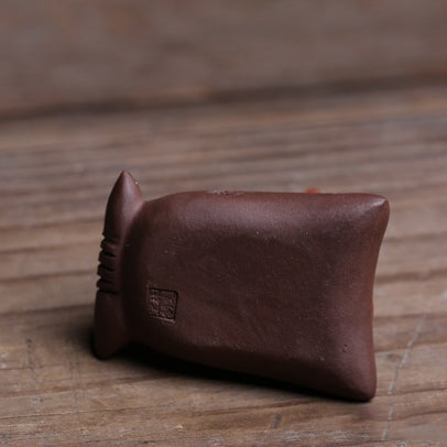 Purple clay tea pet with mouse and treasure design, side view, ideal for tea enthusiasts