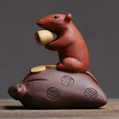 Detailed shot of the purple clay tea pet showing its glossy finish and craftsmanship