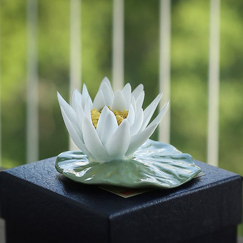 Close-up of a porcelain lotus flower tea pet with intricate details, ideal for tea lovers