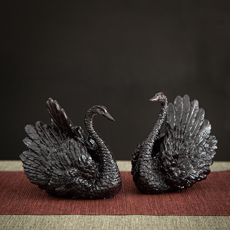 Elegant swan tea pet set displayed on a traditional tea tray.