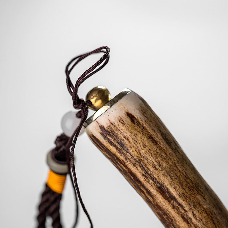 Leather case open with tea knife inside, ready for portable tea preparation