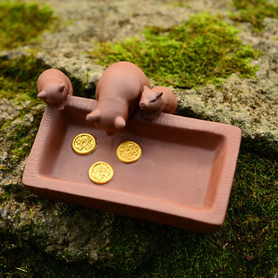 Elegant Yixing clay piggy tea pet with glossy finish and traditional design