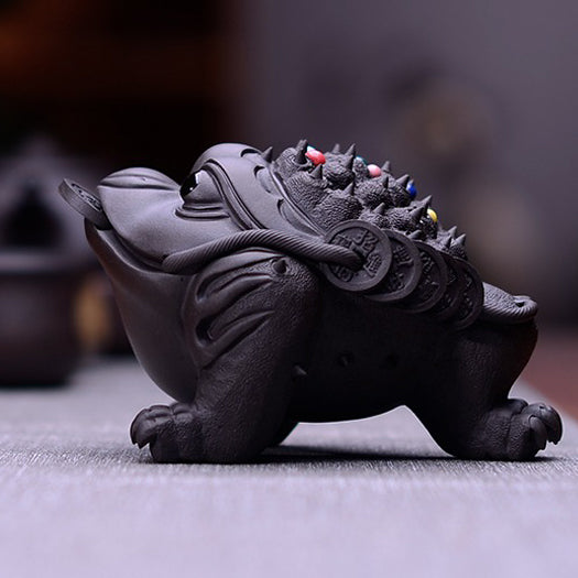 Beautifully glazed Yixing clay toad tea pet with a glossy surface, ideal for tea lovers