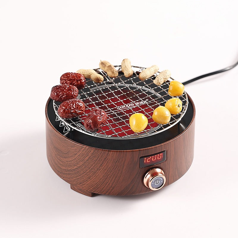 Elegant cast iron tea warmer warming a teapot on induction stove
