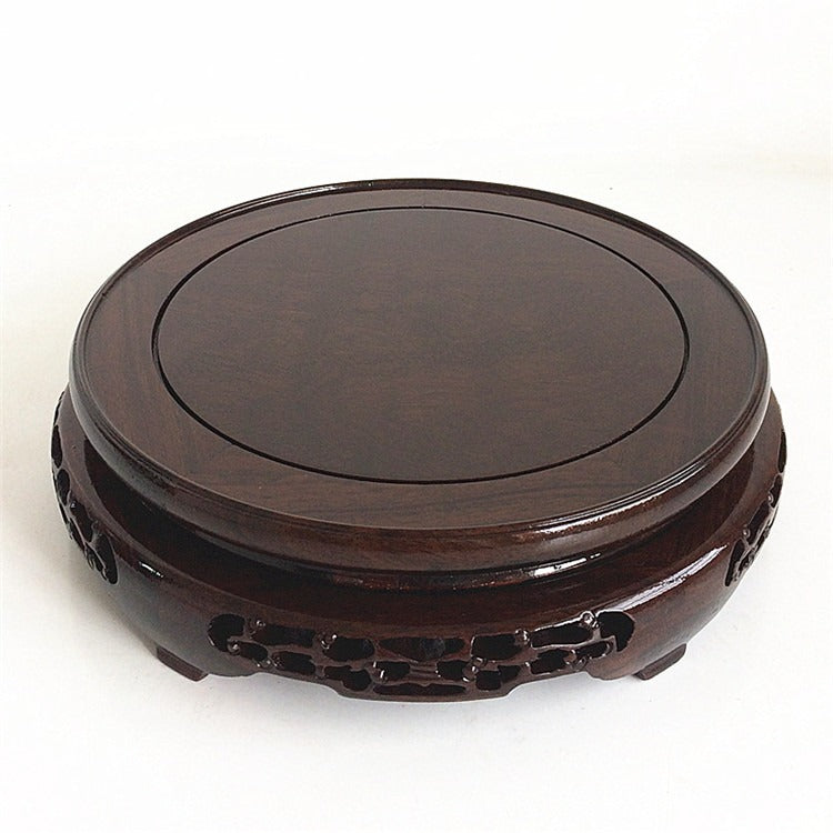 Elegant wooden teapot stand with artistic stripe design in a contemporary setting
