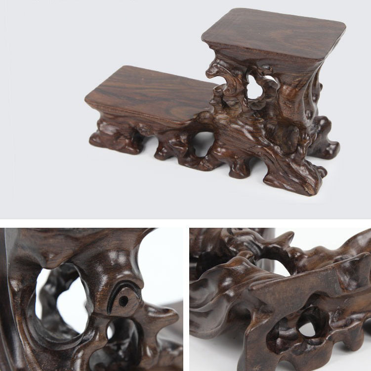 Stylish wooden teapot stand on a tea table, highlighting its artistic design