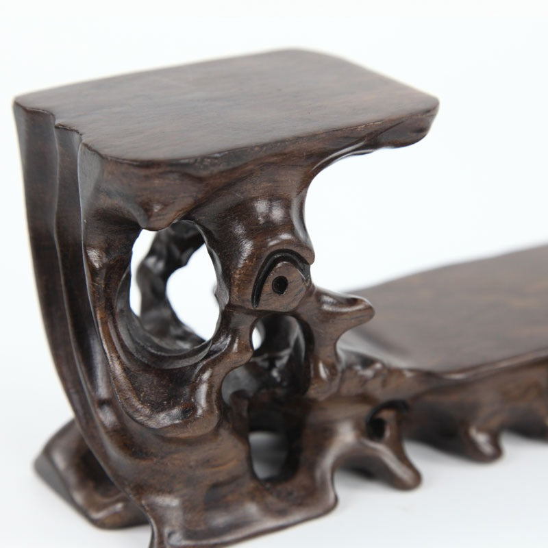 Close-up view of a high-quality rosewood stand showcasing natural grain and craftsmanship