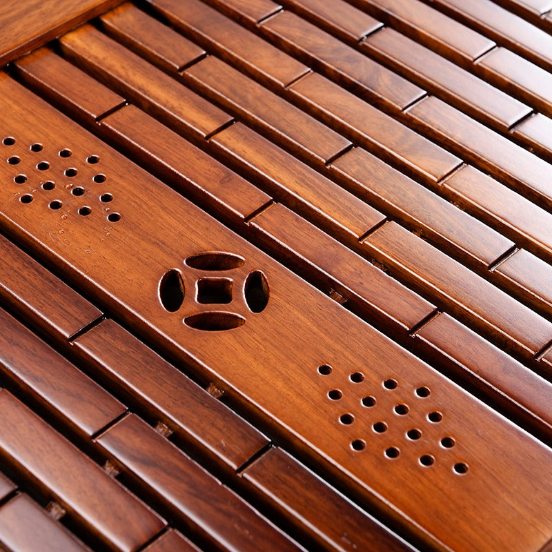 Close-up of the drainage pipe and corner detailing on the tea tray, showcasing craftsmanship