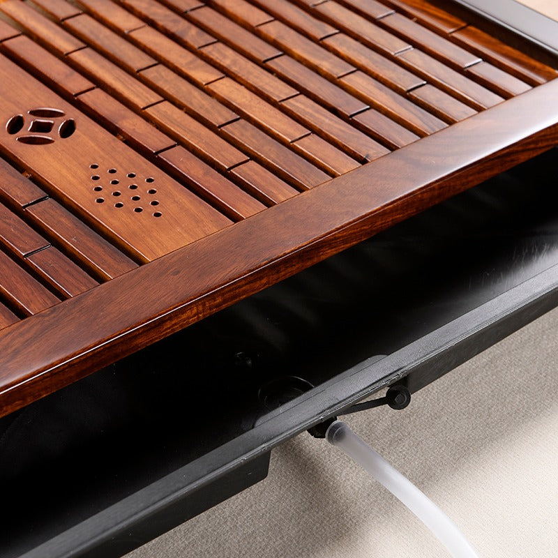 Top-down view of the rosewood tea tray with tea accessories arranged for brewing gongfu-style tea