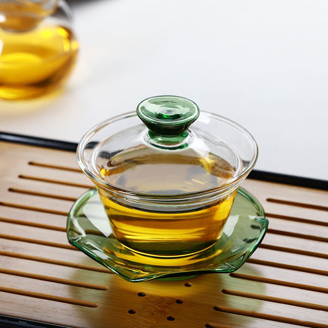 Tea brewing with a heat-resistant glass gaiwan, highlighting its sturdy build and transparency