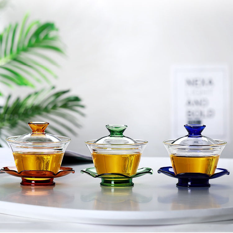 Tea brewing with a heat-resistant glass gaiwan, highlighting its sturdy build and transparency