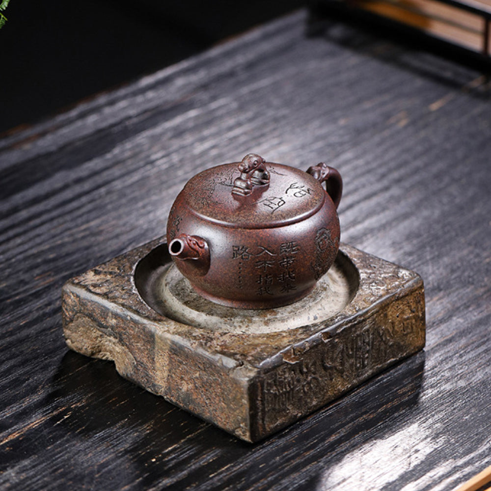 Tea pouring from the monkey teapot, showcasing smooth spout and functional design