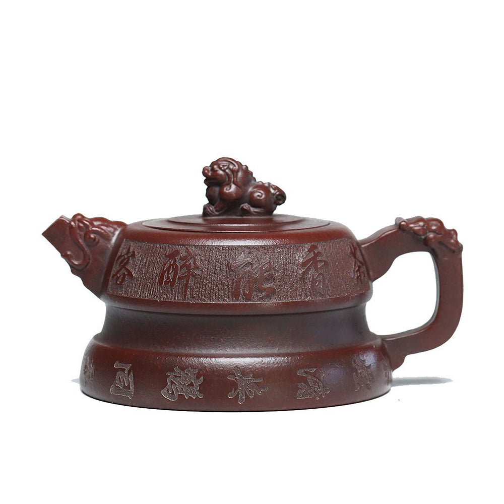 Front view of handcrafted Yixing purple clay lion teapot with detailed carvings
