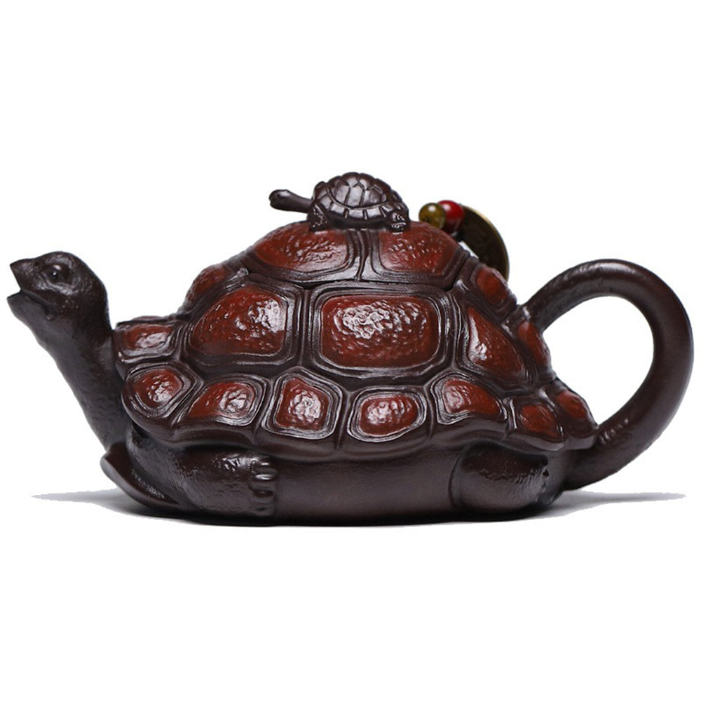 Close-up of handmade turtle teapot showing detailed shell carving