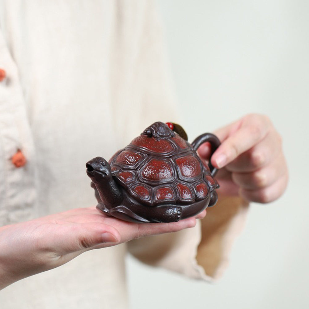 Close-up of handmade turtle teapot showing detailed shell carving