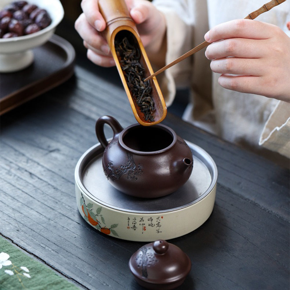 Side view showcasing the elegant shape and spout of the handmade Yixing teapot