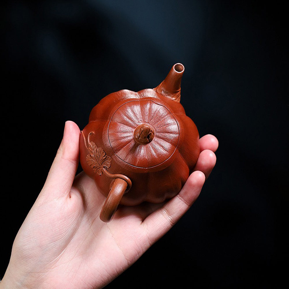 Purple clay teapot in a gift box, perfect for tea lovers.