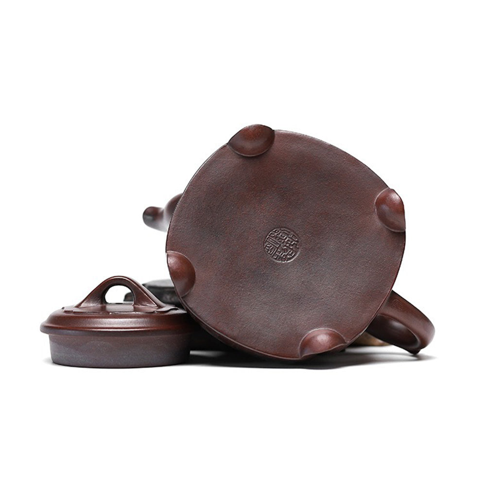 Close-up of the spout and handle of the purple clay lotus teapot