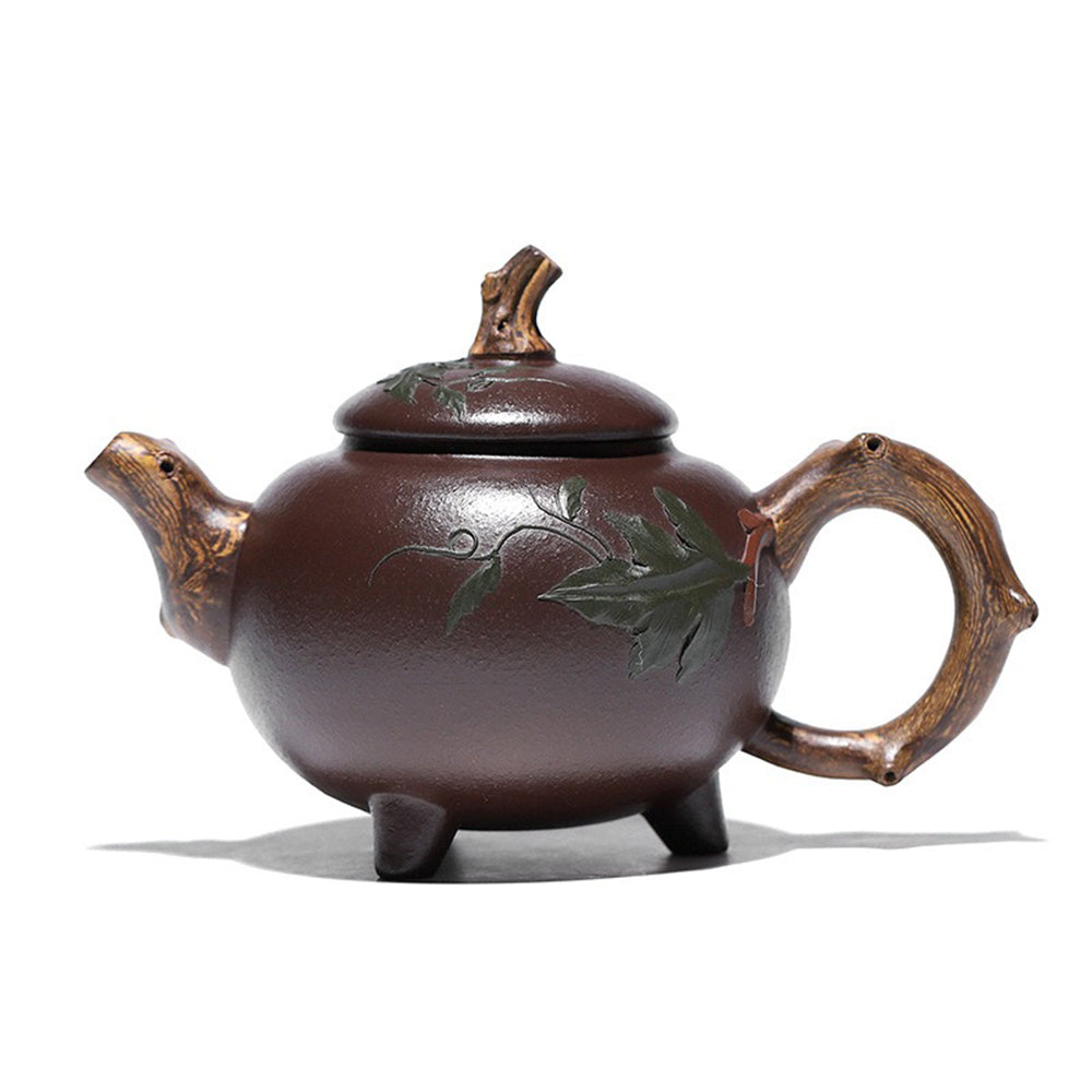 Gourd-shaped purple clay teapot on display, showcasing its natural design