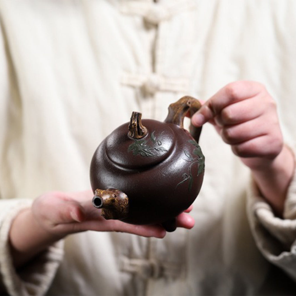 Gourd-shaped purple clay teapot on display, showcasing its natural design