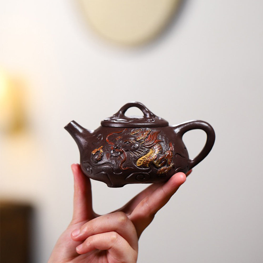 Side view of the purple clay teapot highlighting the smooth spout and rich color.