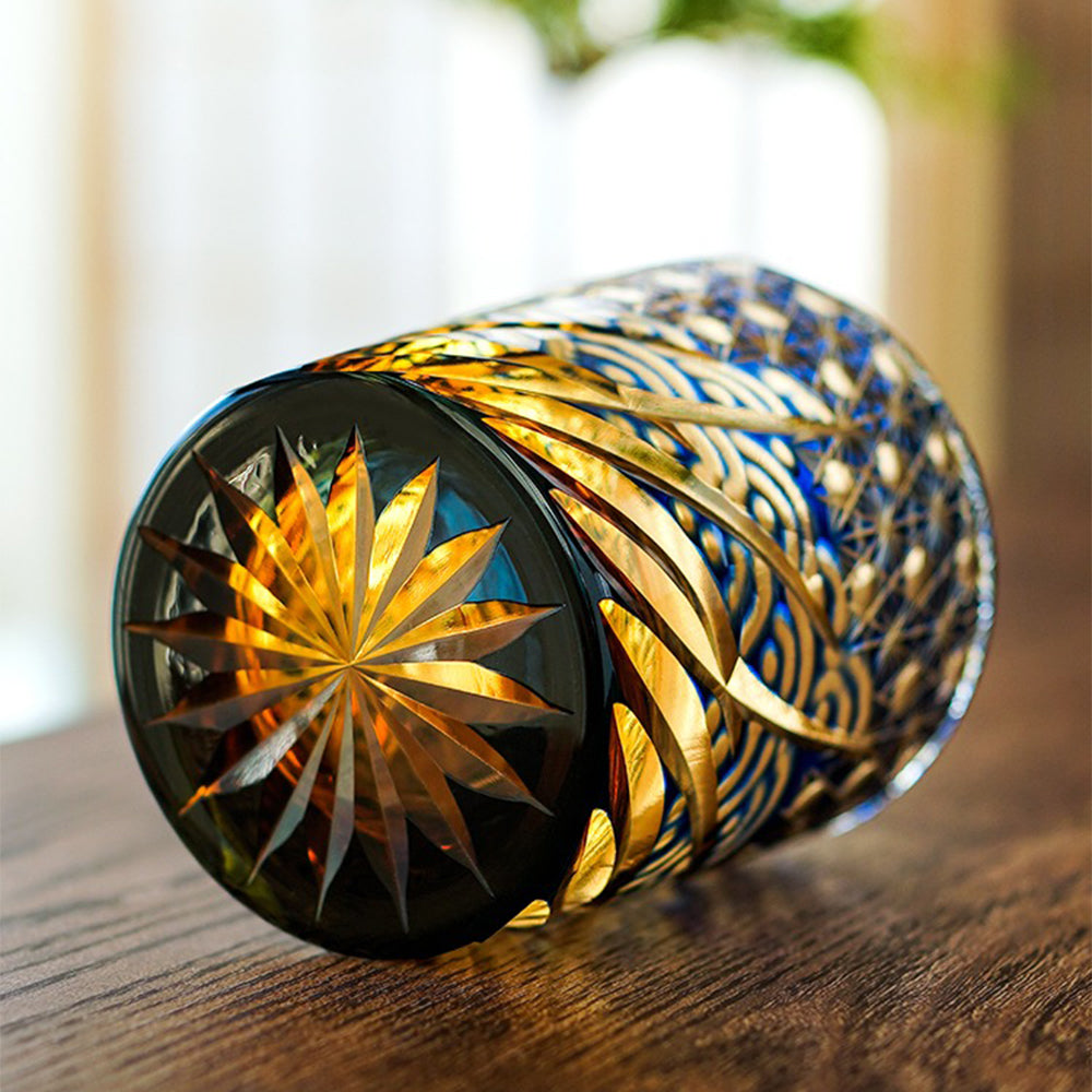 Side view of the unique decorative glass cup highlighting the amber gradient and intricate carvings