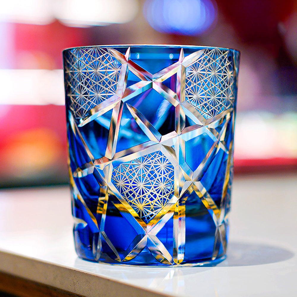 Whiskey poured into the artistic Japanese glass, highlighting vibrant amber and gold hues