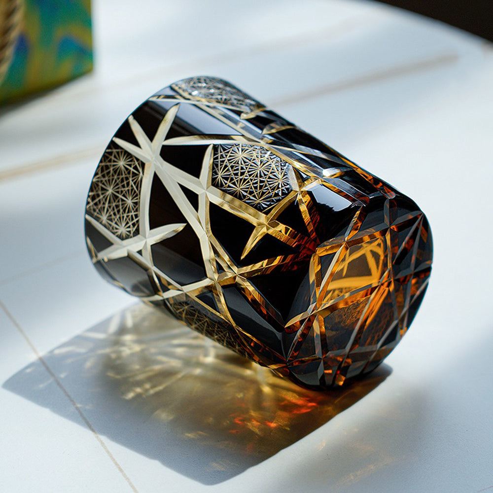 Whiskey poured into the artistic Japanese glass, highlighting vibrant amber and gold hues
