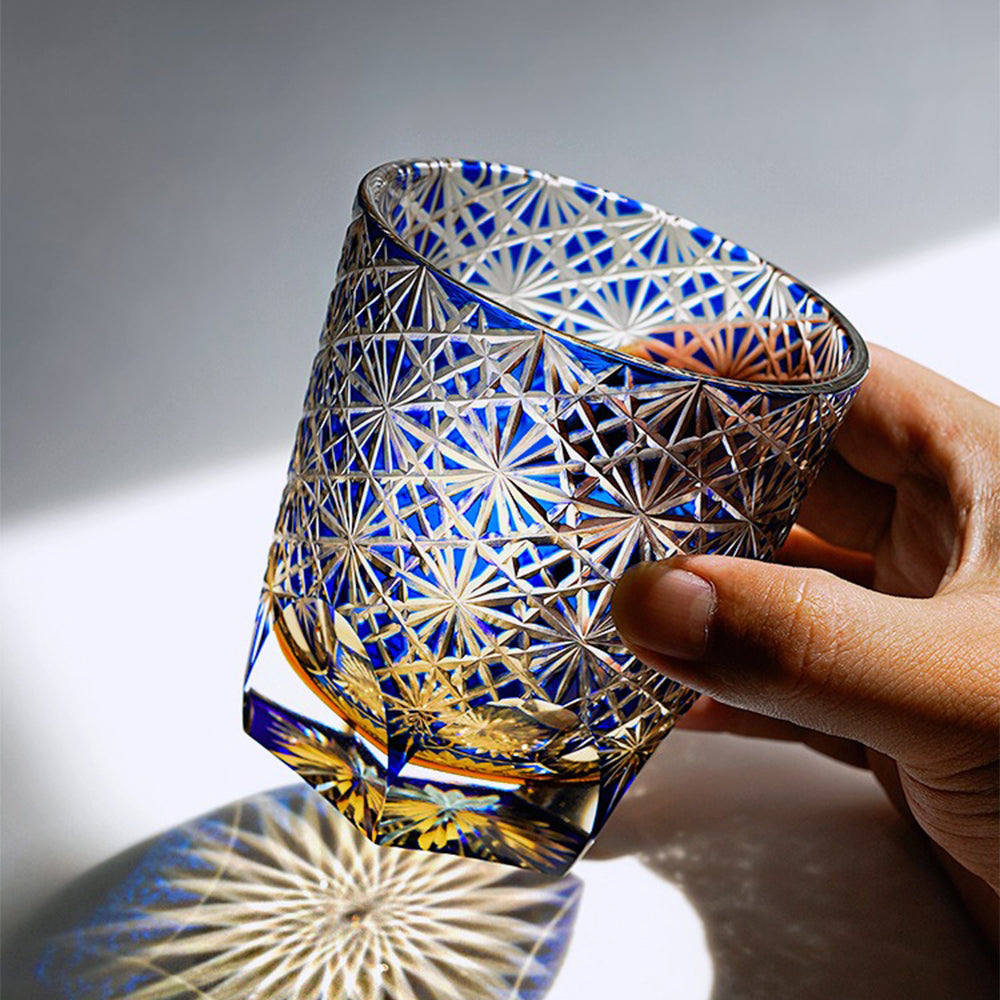 Close-up of Edo Kiriko crystal whiskey glass with star chrysanthemum pattern