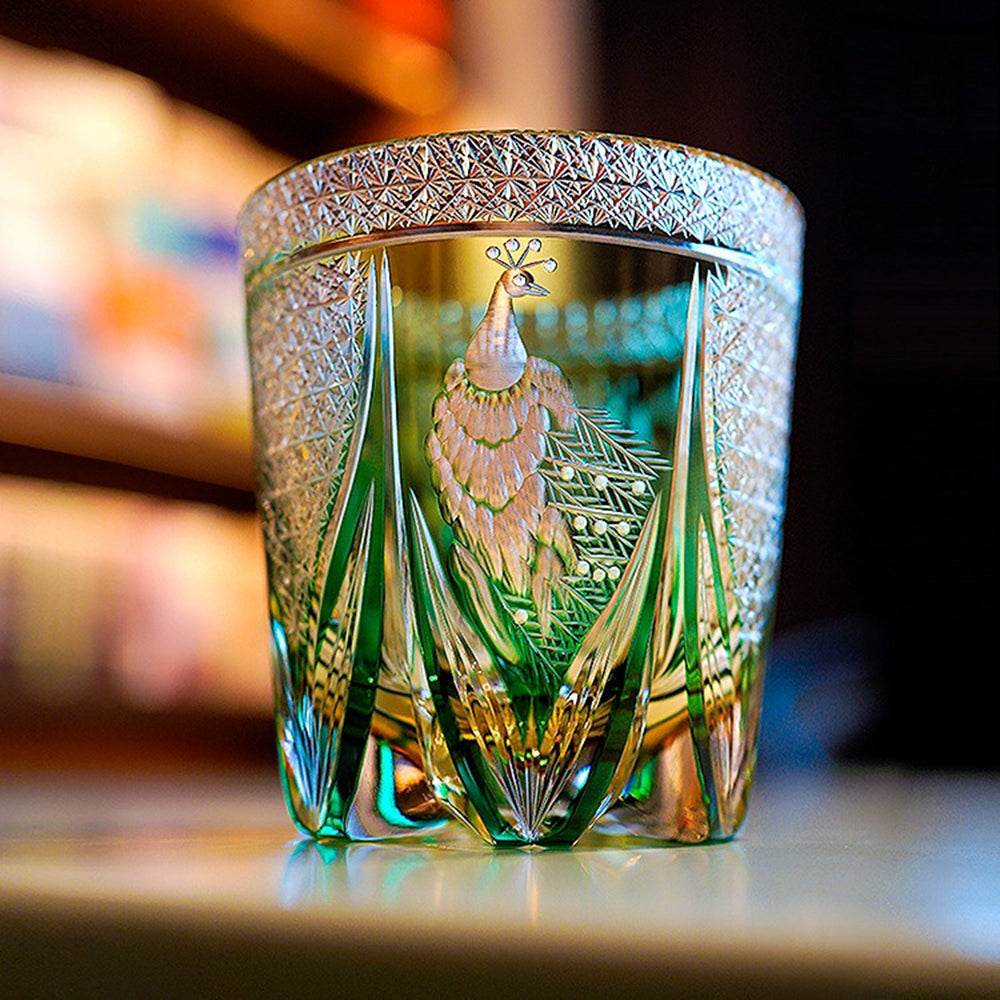 Side angle of crystal glass with thick base and elegant violet hue, ideal for whisky tasting.