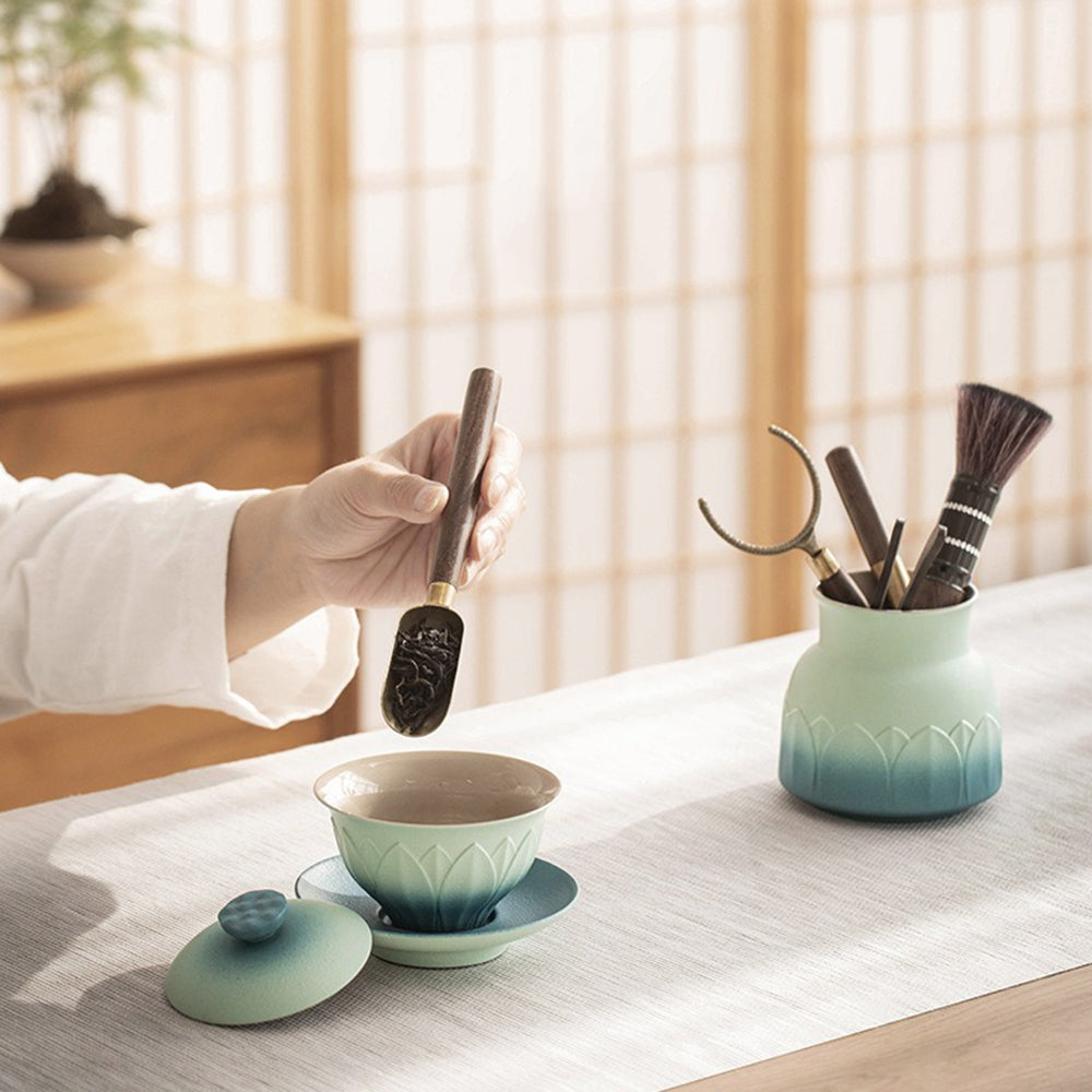 Lotus ceramic tea holder with gradient glaze, emphasizing its ornamental and collectible qualities.