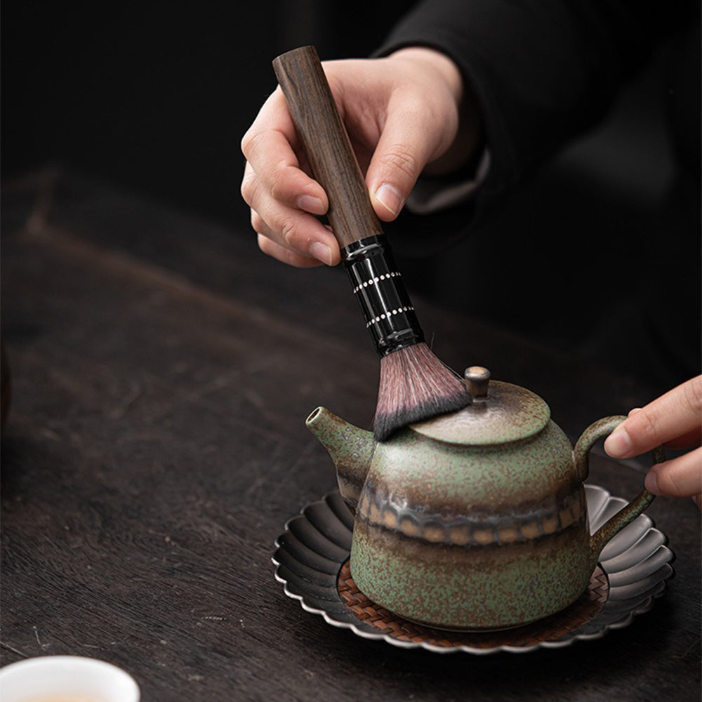 Close-up view of the ebony tea utensils set showcasing the bronze glaze holder.