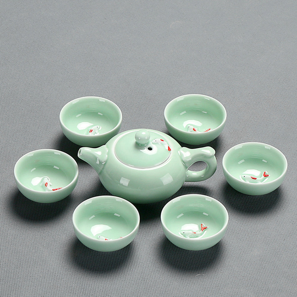Close-up of Jade Porcelain Fish Tea Set with intricate fish pattern and ceramic heat-insulating tray