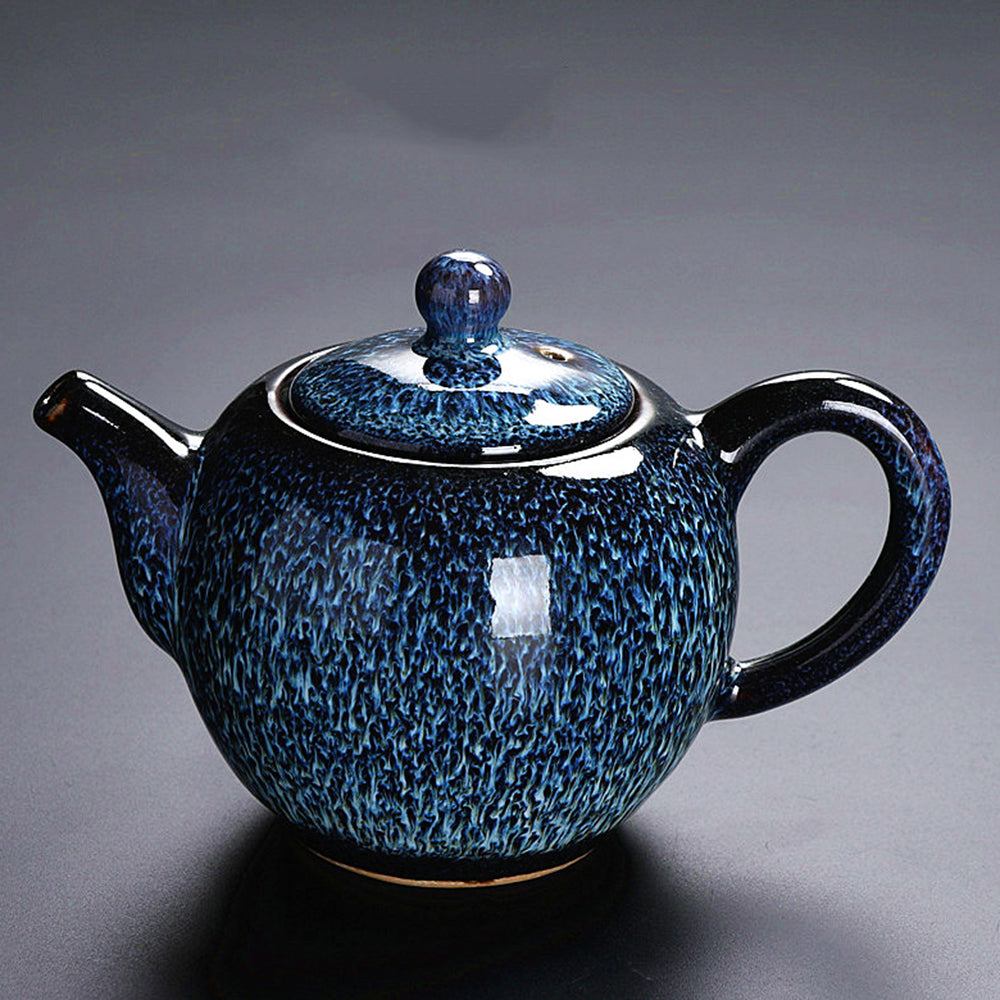 Close-up of the Elegant Tenmoku Automatic Tea Set showcasing its beautiful dark blue glaze.
