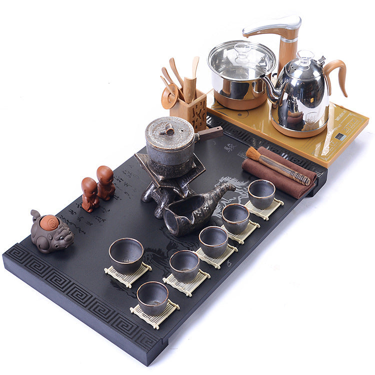 Close-up of the elegant stone mill teapot with black gold tray, showcasing traditional and modern design elements