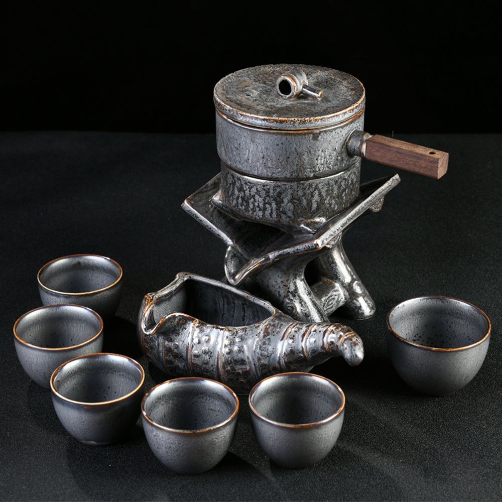 Tea set placed on a stylish wooden table, highlighting the automatic induction cooker and ceramic teapot