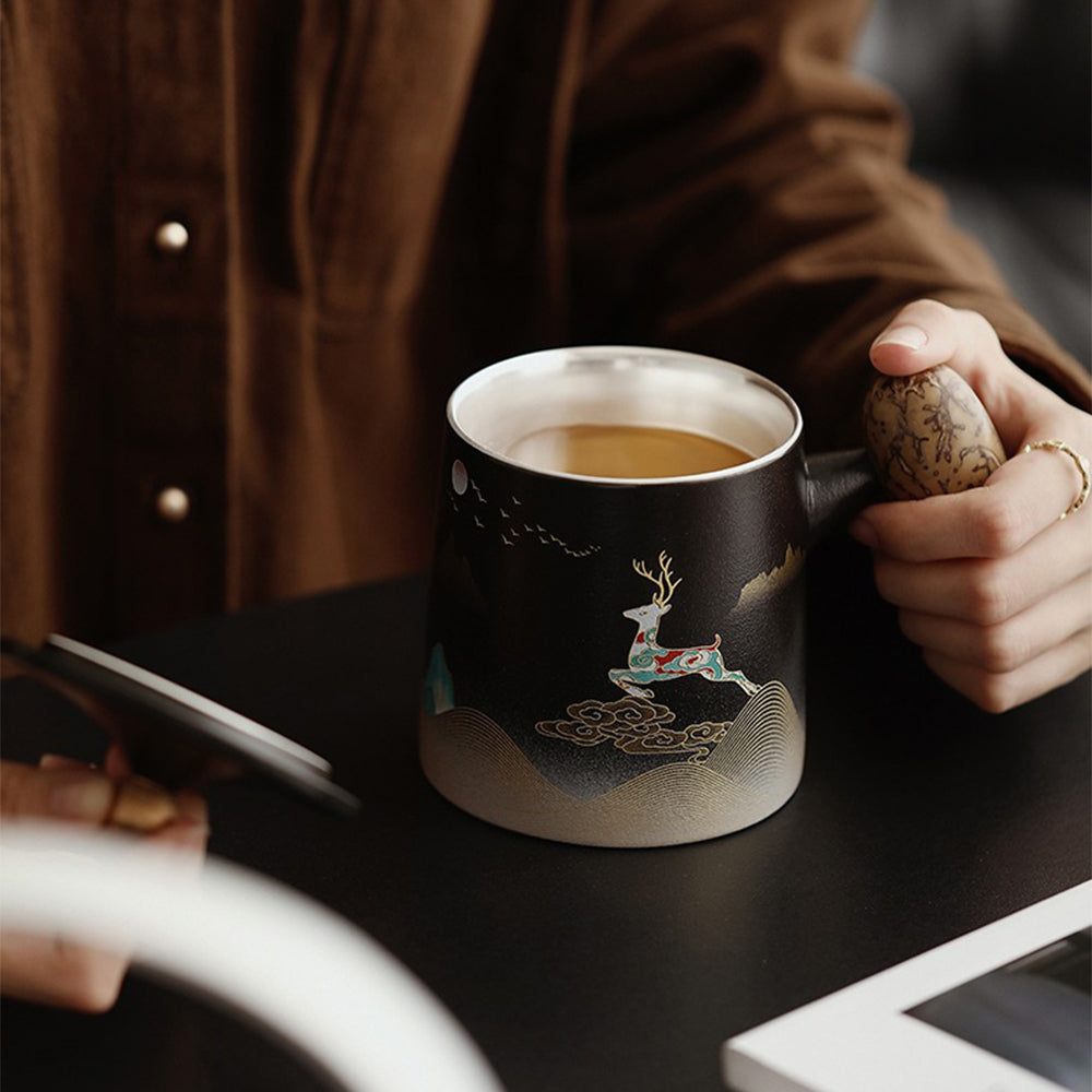 Tea brewing with this luxury ceramic tea cup with infuser, showcasing its beautiful design