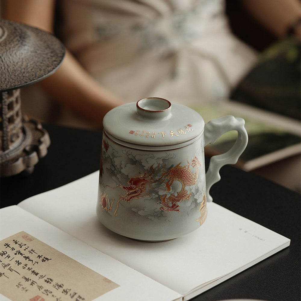 Porcelain mug with dragon design and gold accents, ideal for tea lovers and as a gift