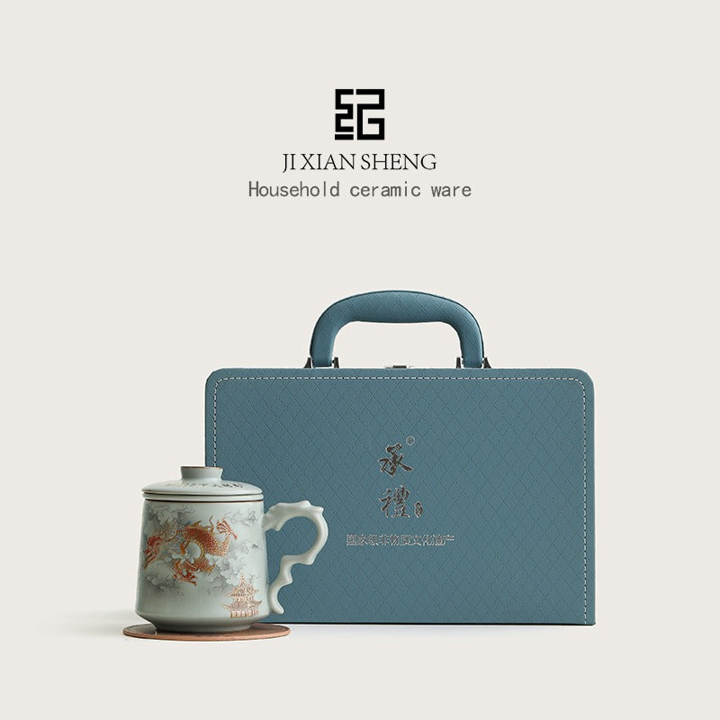 Porcelain mug with dragon design and gold accents, ideal for tea lovers and as a gift