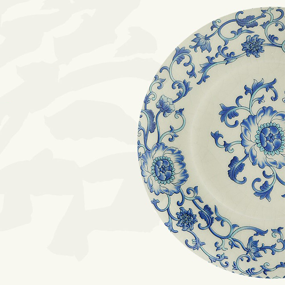 Close-up of blue and white Ru kiln porcelain tea cup with lotus pattern, showing intricate design detail