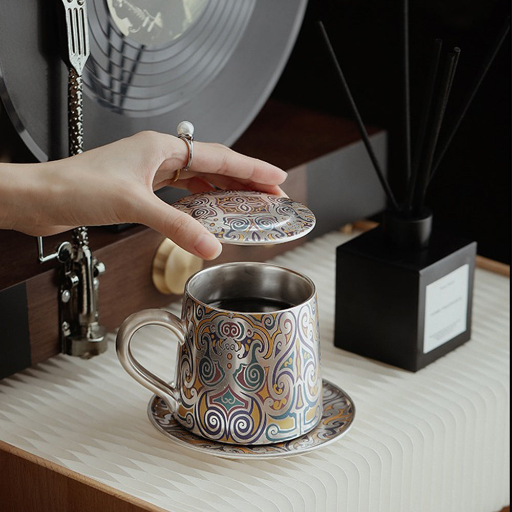 Tea cup with silver interior and comfortable handle, on a wooden table