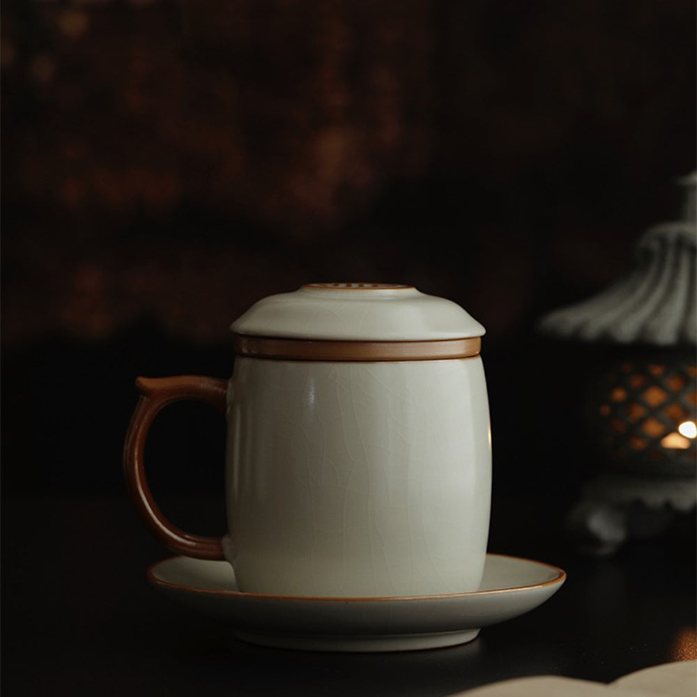 Close-up of beige glazed porcelain cup with intricate cicada wing texture.